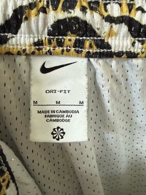 Nike White Athletic Shorts with Black & Gold Leopard Accent
